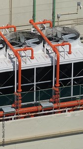 Industrial ventilation system on roof of skyscraper or high buildings. Fan turns in protective casing. Heating, ventilation and air conditioning (HVAC)