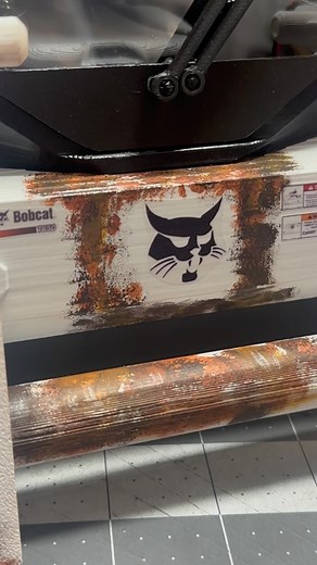 This thing is shaping up to be one rusty beaut. All of the added rust effects still need to get tied in with the airbrush and some dirt, this probably won’t happen until it gets assembled though. #scalerc #scalerccrawler #bobcat #bobcatequipment #skidsteer #rusty #rustygold #3ddesign #3dprinting | Defender Customs