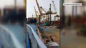 Cargo ship knocks over crane at Indonesian port