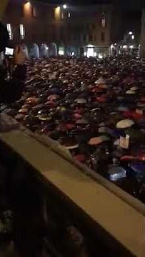 Italy people protest by singing bella ciao in rain