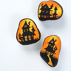 I have been sharing this Haunted House tutorial since 2019!!! Wild how time flies, but I still paint a batch of these each year 🖤 Have you ever tried them? **SUPPLIES** If you need rock painting supplies please consider using our links below. We will make a small commission at no extra cost to you. I did the base coats for these by blending a bunch of them with a big brush - https://rockpainting101.com/gradient-base-coat/ - The lining was all done with my extra fine tip black Posca paint pen (1