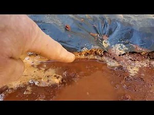 Earth Berm House 13 construction Compact soil with water