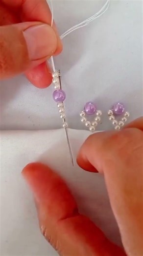 the process of attaching decorative sequins to clothes #shorts