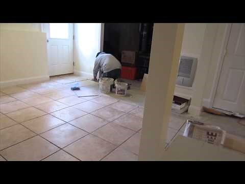 Time lapse of a 16'x16" ceramic tile installation on a basement concrete floor.