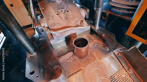 Industrial machine is carving copper sleeves and transporting them