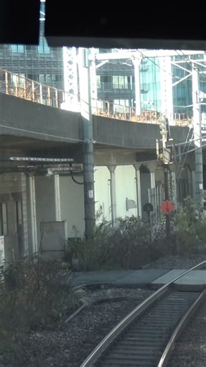 Front view of the outer loop E235 series train restarting after an emergency stop just before Osa...