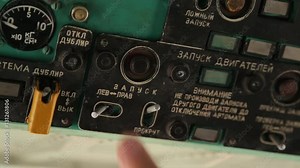 Man's hand turn on off helicopter engine. Closeup. Interior of cabin Mi-8 helicopter. Control panel, dashboard, bottoms of htlicopter. Start engine.