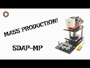 MASS-PRODUCING BUTTON MACHINE