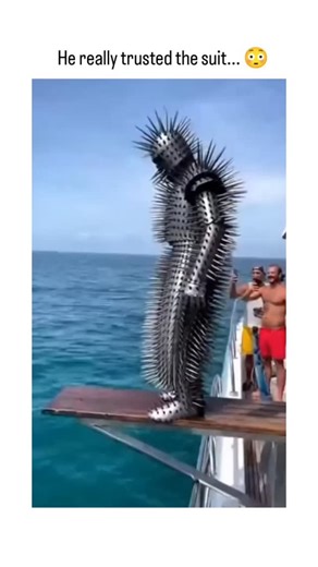 neural.scratches | This video is a classic example of high-intensity "scroll-stopping" content. It features a man in a specialized "spike suit" (meant to... | Instagram