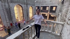 Chinese opera singer Wang-Fang performs Russian song \"Katyusha\" on the ruins of the Drama Theater in Mariupol