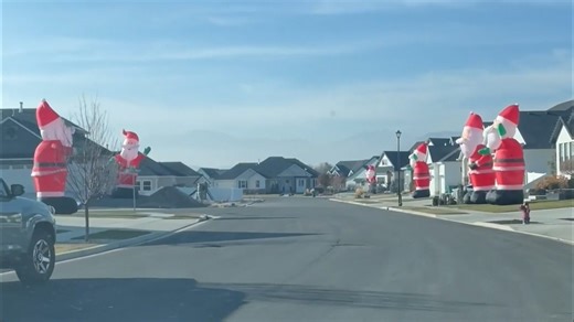 Watch: Giant Santa inflatables take over Utah neighborhood