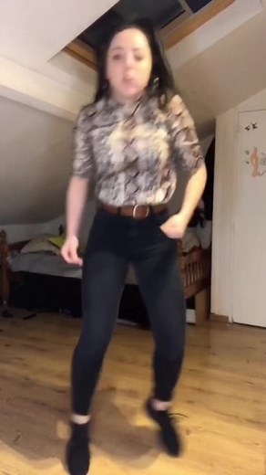 Engaging Dance Routine in a Cozy Bedroom Setting