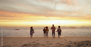 People, running and beach with friends in sunset for holiday weekend, vacation or outdoor freedom together. Rear view of group playing and enjoying summer sunrise on sand by the ocean coast in nature