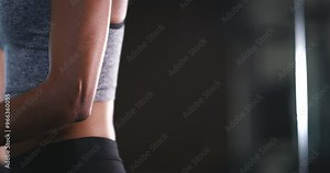 Mirror, gym and fitness woman with cable machine for cardio, bodybuilding or resilience training. Reflection, face or athlete profile with rope pull workout for wellness, Weight loss or arm challenge