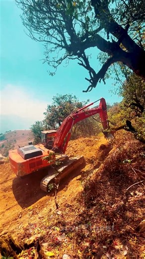 Hitachi Excavator in Action, View from top of the Mountain