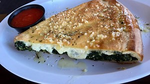 Review: Storm damage can't stop Ryan's from serving substantial pizza