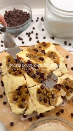 Anastasia D’Amario | High Protein Recipes on Instagram: "🍪 COOKIE DOUGH CHEESECAKE BARS ↓ Want to eat healthier without giving up dessert? I got you. 😏 These delicious cookie dough cheesecake bars are the ultimate sweet treat for when you’re craving decadence but still have fitness goals to reach! 🔥 (Also: you can totally trick your family and friends into eating better with you! 👀) Comment “love desserts” or “yummy” and I’ll send you my low-sugar/sugar-free dessert book with 40+ sweet treat