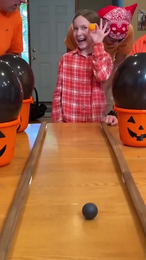 Ping Pong Pumpkin Challenge 🎃 The whole family plays a funny Halloween party game where they pour ping pong balls across the table and try to get one in the tiny cup. Whoever gets the orange Jack-O-Lantern ball in, gets a special prize. " 🎬 This video was produced by Network Media and Benson Bros" | Play Together Stay Together