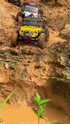 Extreme RC Jeep Crawling Down A Mud Cliff