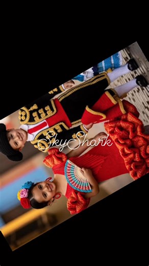 In a vibrant display of cultural pride, a boy and girl model traditional Spanish costumes, meticulously crafted from crochet materials. These intricate outfits are more than just clothing; they represent a beautiful fusion of heritage and artistry. The event, held in a school to celebrate the United Nations, highlights the importance of cultural exchange and understanding. By showcasing Spanish traditions, the students learn to appreciate the rich tapestry of global cultures. This celebration un