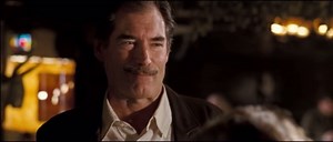 In Hot Fuzz (2007), when raising his glass to the memory of Eve and Martin, Timothy Dalton briefly looks into the camera. Edgar Wright considered editing it out, but thought it was so funny that he added the sound of a cash register to call attention to it.