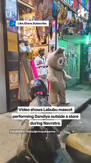 Labubu mascot brings festive vibes, performs Dandiya outside a store. #labubu #dandiya #viralvideo #mascotdance #festivalseason #funnyvideo #india | Indiatimes