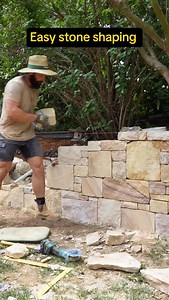Another brick(stone) in the wall. In this video I’m showing how I shape 99% of stones, using the chipping hammer and my leg as the cutting table. It works for me and is super effective. Works well with smaller stones, not so much with risers . Don’t try this home, or do, what’s the worst that can happen? We have 10 fingers for a reason, couple spares. #stonemason #mason #construction #landscaping #crafting | Ivey Masonry