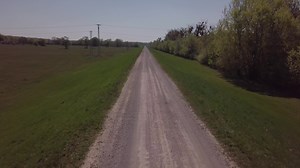 Download Drone flying low above a road in 4K for free