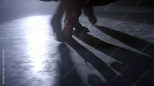 Ballroom couple feet moving on stage. Unrecognizable man woman legs dancing.