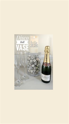 Claire Bell on Instagram: "Disco Ball Vase Idea A super quick and fun way to add a little New Years Eve decor to your home. Using a glass vase, with sellotape around the top, to keep the glitter straight, add some PVA Glue and sprinkle with glitter. Then i used a glass upside down, adding my mini disco balls and silver baubles and finishing with a Led Candles for the top. A super quick way to add some sparkle for party season. What are your NYE plans? Have a fab evening xo Claire #centrepieces #