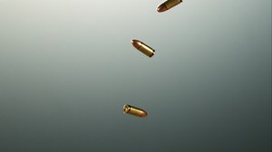 Download Bullets falling and bouncing in ultra slow motion 1,500 fps on a reflective surface - BULLETS PHANTOM 031 for free