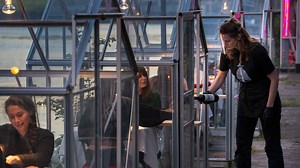 Dutch restaurant’s glass booths let people dine and distance
