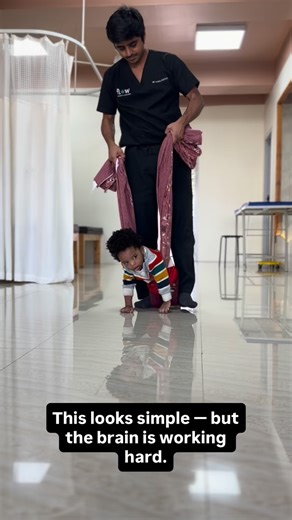 Flow Physiotherapy and Rehabilitation, Bengaluru on Instagram: "In this reel, the parachute (protective extension) reflex is stimulated by creating a controlled challenge to balance. The child is partially unloaded using blanket suspension, allowing active crawling while reducing the effect of gravity. Gentle upper-limb facilitation followed by a controlled release provides sensory input through the joints and muscles, prompting hand opening and forward protective extension. Repeated, safe expos