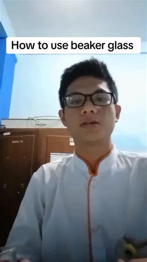 Demonstrating Beaker Glass Use in Medical Technology