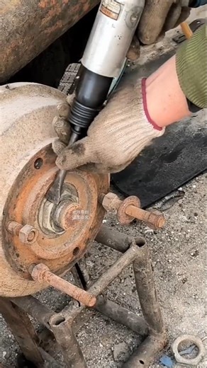 Air Hammer ⚒️ pneumatic removing a stuck axle nut on a vehicle wheel hub using an air hammer tool's