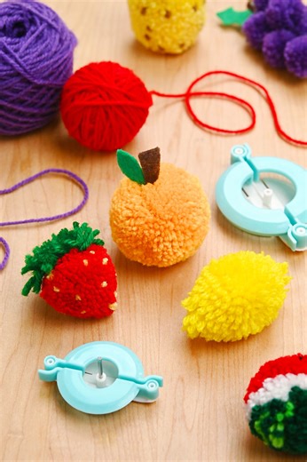 18K views · 114 reactions |  Craft your own fruity fun without having to shop the produce aisle! Learn how to make a whole basket of pom pom fruits, from fuzzy strawberries and pineapples to adorable grapes, peaches, and even watermelon! Soft, squishy, and SO cute, these little fruits are perfect for pretend play, garlands, keychains, or just brightening up your space. https://onelittleproject.com/pom-pom-fruit/ | One Little Project | Facebook