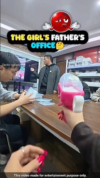 The game is being played in the office... because the girl's father is the boss of this office.