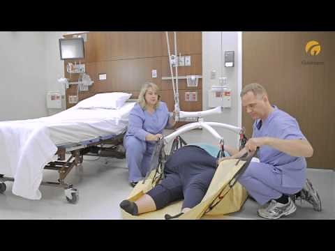 Guldmann Ceiling Lift: Bariatric Repositioning Sling - Lifting from floor to bed
