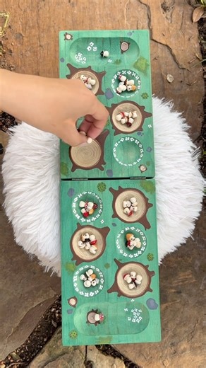 👑 mancala 101 !! Please note these are the base rules I grew up with (and that come with the blank boards I buy lol) there are other fun versions like avalanche and capture 😇 . Custom 1/1 mushcala set by me not for sale 48 ceramic mushroom pieces mossy fairy forest board . Ps game of shrooms is less than a month away and I’ll be dropping art in Houston AND San Antonio 🥳 . #mancala #cutegame #cozygames | The Midori House