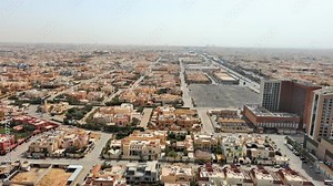Riyadh: Aerial view of capital city of Saudi Arabia, low-rise residential buildings in Arabic style - landscape panorama of Arabian Peninsula from above