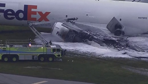 FedEx plane catches on fire after its landing gear collapses while landing