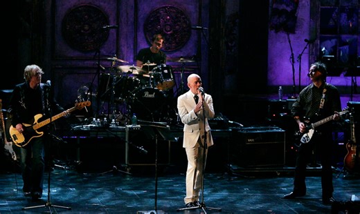 Retired rock band R.E.M. makes surprise reunion to perform classic hit