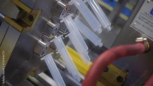 The process of extrusion equipment operation - the movement of different parts - manufacturing disposable plastic products. Slow mo, slow motion, slo mo, high speed camera, 240fps, 250fps