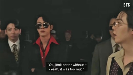 So Taehyung was supposed to have his hair tied in a ponytail but he didn’t do it because it was not matching the era they were in. Look at how enamored BTS were by Taehyung in a beard they couldn’t stop staring at him