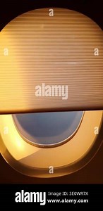 Airplane window with automatic electronic shade opening and closing during flight. View of sky and clouds from aircraft cabin window. Modern aviation technology inside passenger airplane Stock Video Footage - Alamy