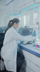 Modern Medical Research Laboratory: Female Scientist Working with Micro Pipette, Analysing Biochemicals Samples. Advanced Scientific Lab for Medicine, Microbiology Development. Vertical Video
