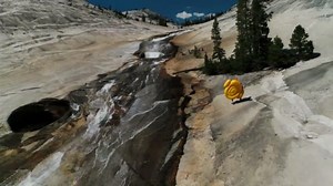 Guys Slide Down Natural Water Slide