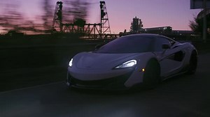 Mclaren supercar driving on portland Oregon street in the citys urban landscape