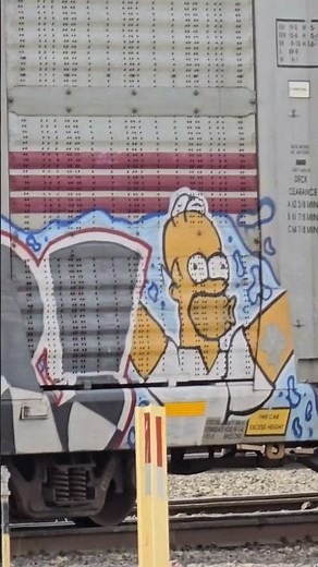 Homer and Bart Simpson on Autorack Train Car