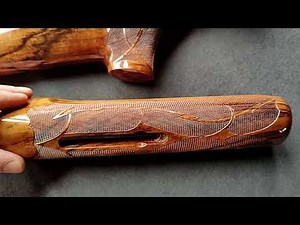 Hand cut custom gunstock checkering with woven ribbons and barbs